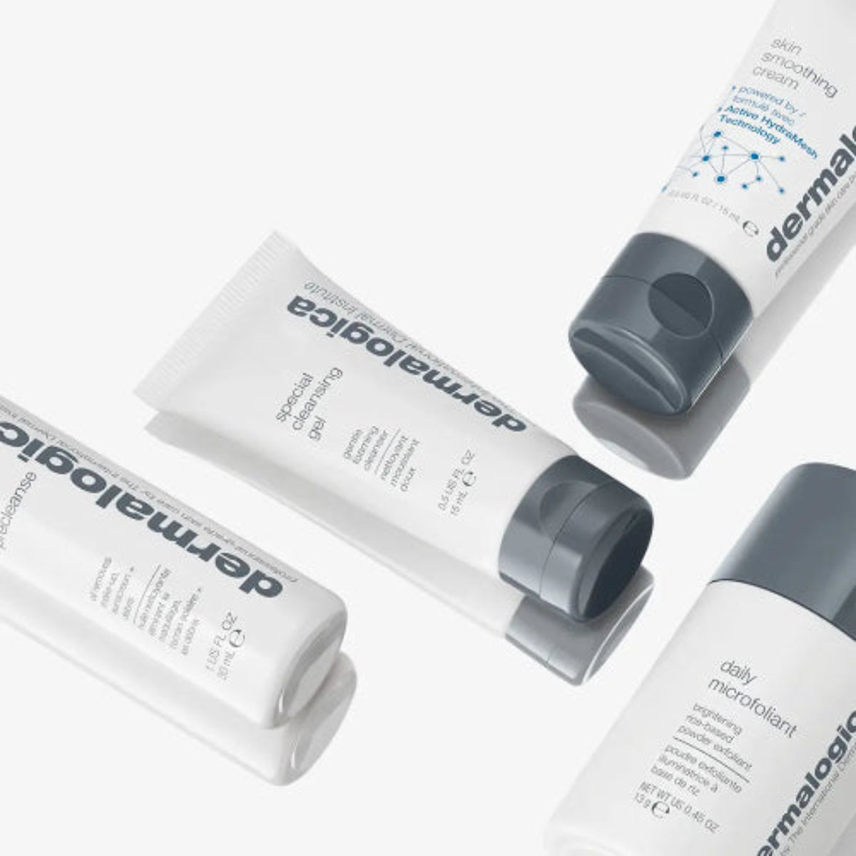 Fire Dermalogica-produkter lagt ut på rad – prerens, rensegel, eksfolieringspulver og fuktighetskrem for komplett hudpleierutine